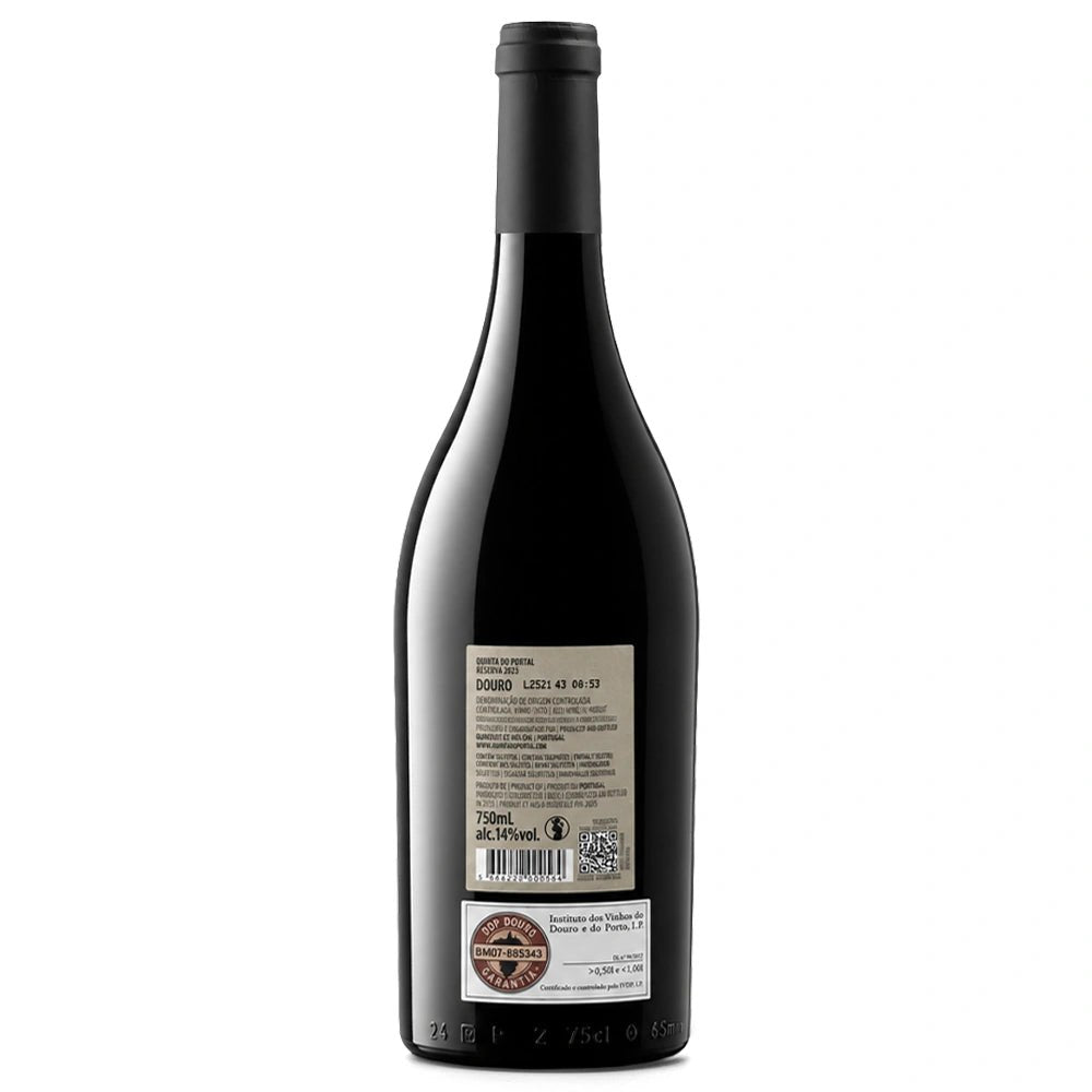 A dark glass bottle of red wine shown from the back, featuring a black screw cap and two labels, one of which displays the 'Santafé de Bogotá' brand logo.