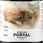 Close-up of a wine label reading 'QUINTA DO PORTAL', 'DOURO VALLEY', and 'PORTUGAL', with a large abstract brown and beige illustration on a white label background.