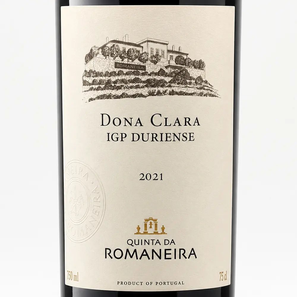 A close-up of a wine bottle label for Quinta Da Romaneira Dona Clara IGP Duriense 2021, featuring a beige label with a black illustration of a vineyard estate and a small gold crest.