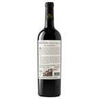uinta da Romaneira Dona Clara. A bottle of red wine shown from the back, featuring a black glass body, a black neck capsule with gold lettering, and a large white label with text and a small architectural illustration.
