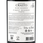 The back of a Quinta do Crasto Ruby Reserva Port wine bottle, showing the Portuguese and English label text, volume of 750ml, alcohol content 12% vol, and a vegan logo.