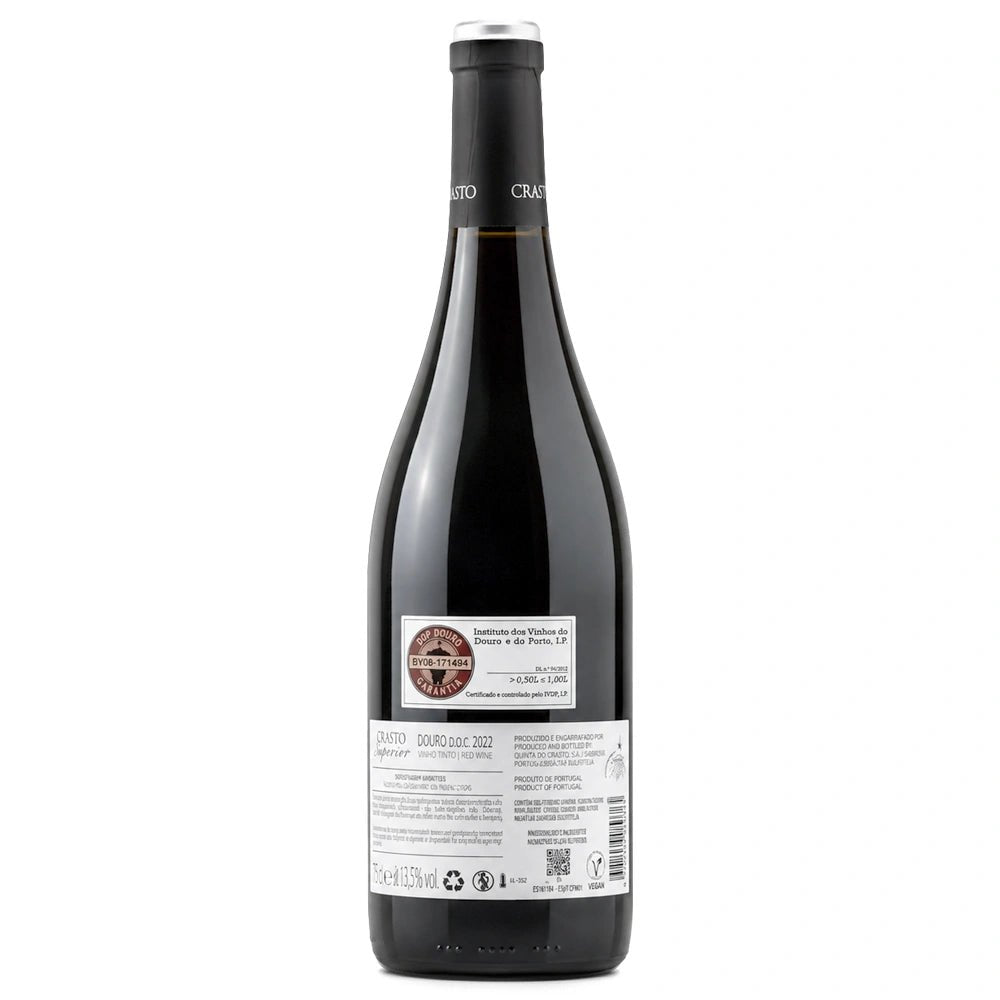 Crasto-superior-bottle. The back of a dark glass wine bottle with a black capsule and a white label, photographed against a plain white background.