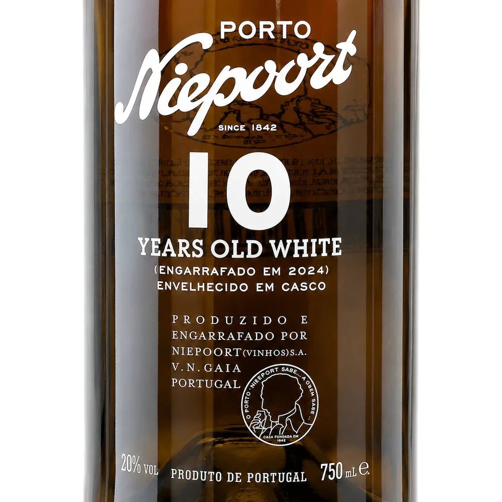 Close-up of a Niepoort 10 Years Old White Port wine bottle, showing the white label text against the dark amber glass.