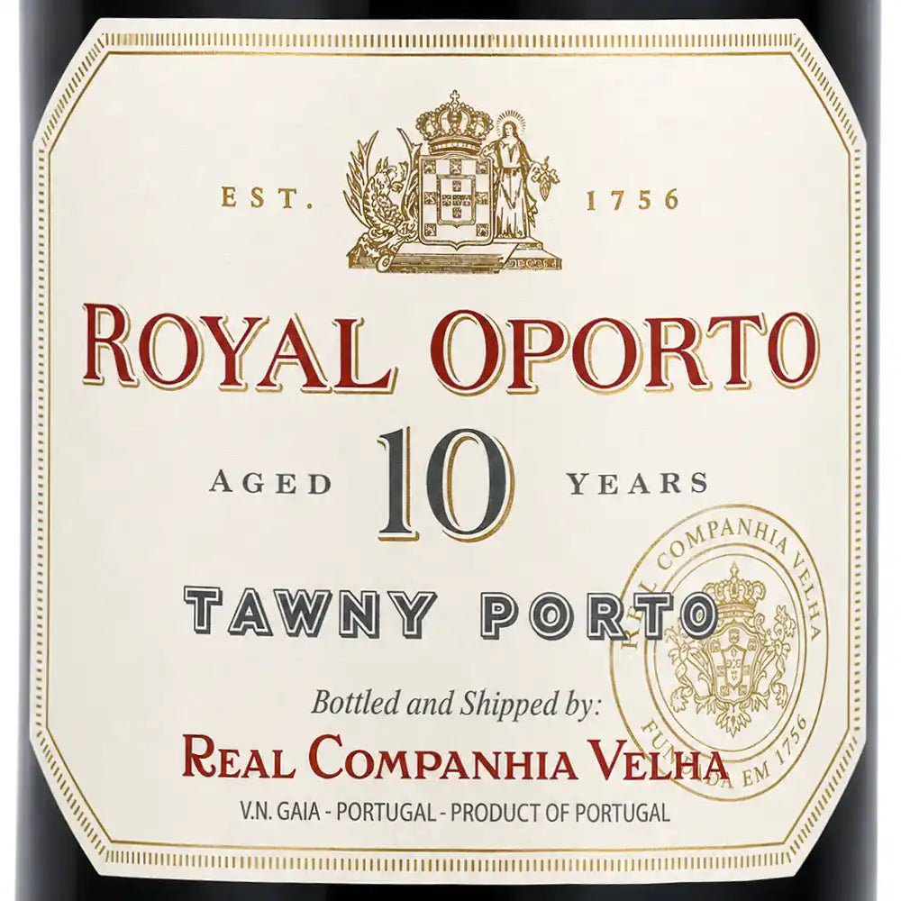 A close-up of a wine label for Royal Oporto Tawny Porto, aged 10 years. The label is cream-colored with elegant red and gold typography, featuring the Royal Oporto crest at the top and the Real Companhia Velha seal on the bottom right.