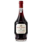 A bottle of Royal Oporto 10 Tawny Port wine, featuring a dark glass bottle filled with deep red-brown liquid, a cream-coloured label with red and black text, and a dark red foil cap, set against a plain white background.