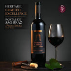 A bottle of Portal de Sao Braz Private Collection red wine stands on a dark surface beside a filled wine glass, a corkscrew, and green leaves, with promotional text on the left and a logo in the upper right.