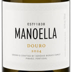 Close-up of a white wine label reading MANOELLA DOURO 2024, with black and gold typography on a clean white background.