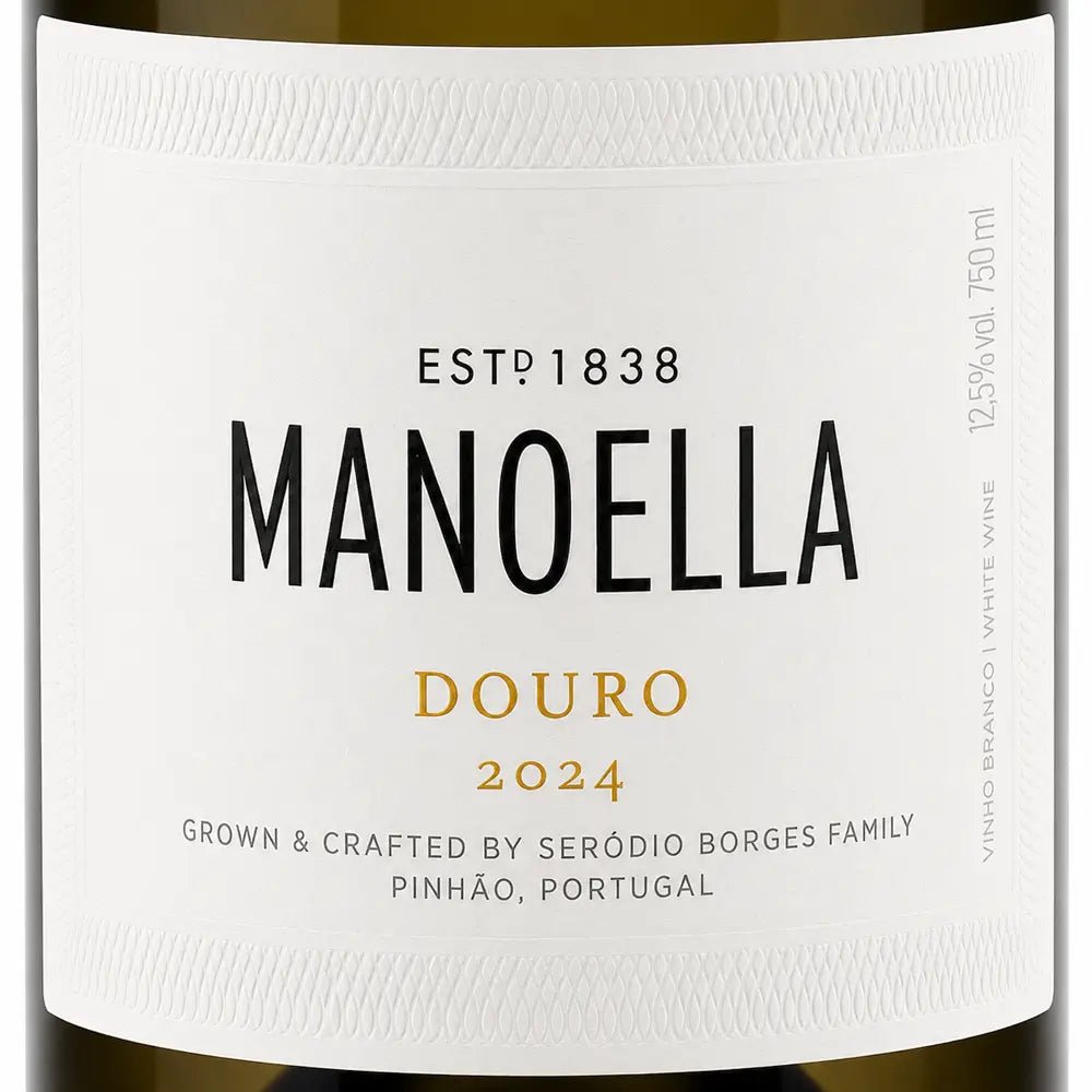 Close-up of a white wine label reading MANOELLA DOURO 2024, with black and gold typography on a clean white background.