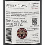 Close-up of a wine bottle label for Quinta Nova Doc Douro 2024, showing product details, barcode, QR code, and certification seal on a dark bottle background.