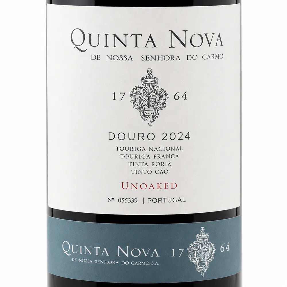 A close-up of a Quinta Nova wine bottle label, showing the white main label with black text and crest, plus a blue lower band with the brand name and vintage information.
