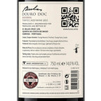 The back of a Douro Doc Reserva wine bottle label, showing product details, QR codes, volume information, and certification logos on a white background.