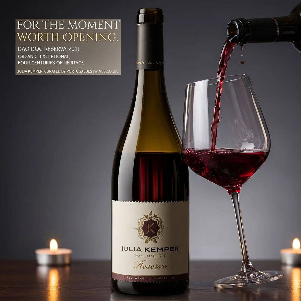 Bottle of Julia Kemper Reserve wine with a glass being filled, candles in the background.