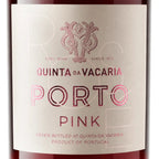 A close-up of a wine bottle label reading 'QUINTA DA VACARIA PORTO PINK' with a pink monogram logo and pale blush label on a dark bottle background.