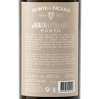 The back of a wine bottle label for Quinta da Vacaria White Branco Extra Dry Seco Porto, showing product details, translations, a barcode, and regulatory text on a dark bottle background.