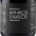 Wine bottle label with 'Aphros Yakkos' text on a black background
