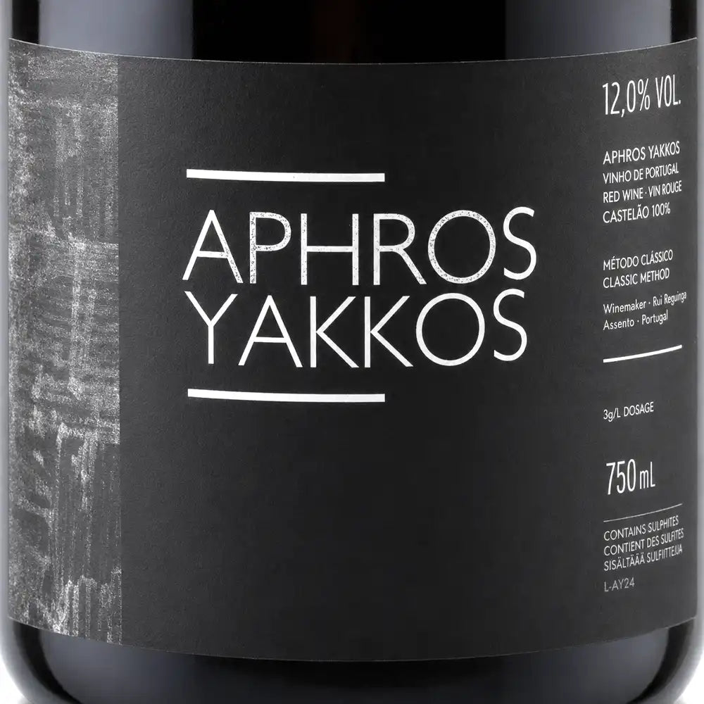 Wine bottle label with 'Aphros Yakkos' text on a black background