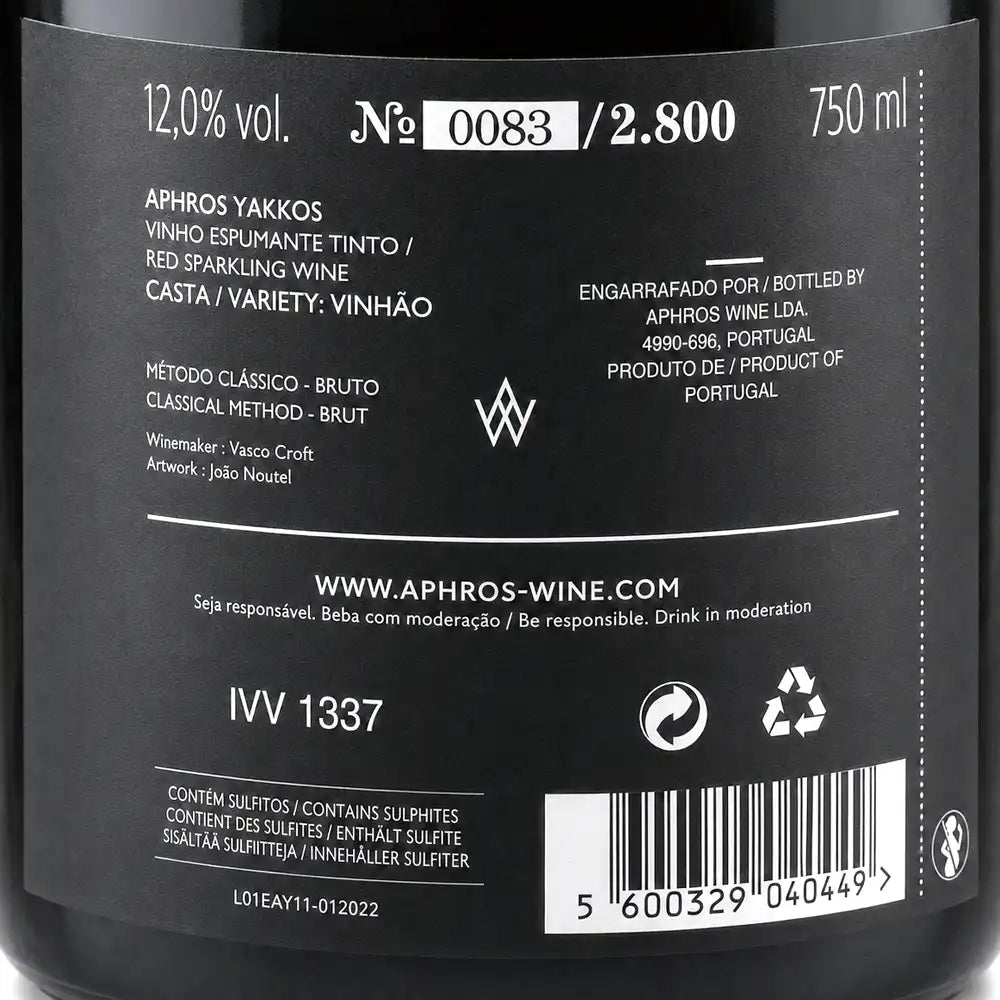 Back label of a wine bottle with text and symbols on a black background