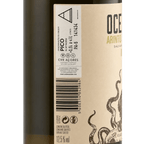 Wine bottle label with 'Oceano Arintos' branding and octopus design.