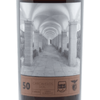 Wine bottle label with an architectural design and text on a white background