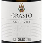 Close-up of a wine bottle label reading CRASTO ALTITUDE 430 DOC DOURO 2022, with a white label, black text, and a small multicolor crest at the top.