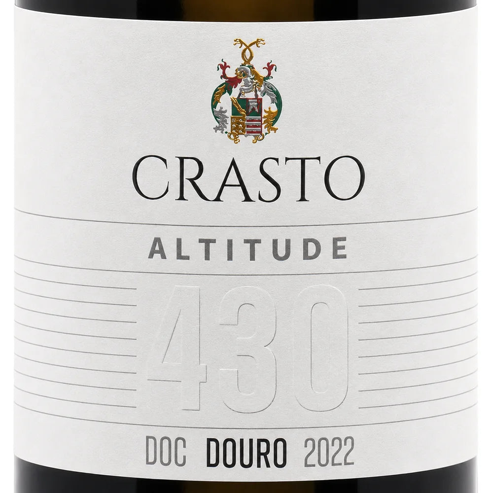 Close-up of a wine bottle label reading CRASTO ALTITUDE 430 DOC DOURO 2022, with a white label, black text, and a small multicolor crest at the top.