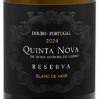 Close-up of a wine bottle label reading Douro · Portugal, 2024, Quinta Nova De Nossa Senhora do Carmo Reserva, with ornate black label design and gold and white text.