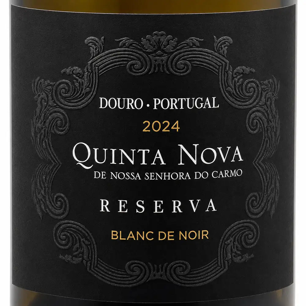 Close-up of a wine bottle label reading Douro · Portugal, 2024, Quinta Nova De Nossa Senhora do Carmo Reserva, with ornate black label design and gold and white text.