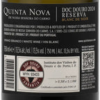Close-up of the back label of a bottle of Quinta Nova Doc Douro Reserva Blanc de Noir white wine, showing product details, barcode, QR code, and certification marks on a dark background.