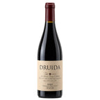 A bottle of DRUIDA red wine with a dark glass body, beige label, and dark red foil at the top, shown against a plain white background.