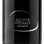 Close-up of a dark wine bottle label reading 'QUINTA DO FERRO' and 'TINTO BRUTO' in white text on a glossy black bottle.