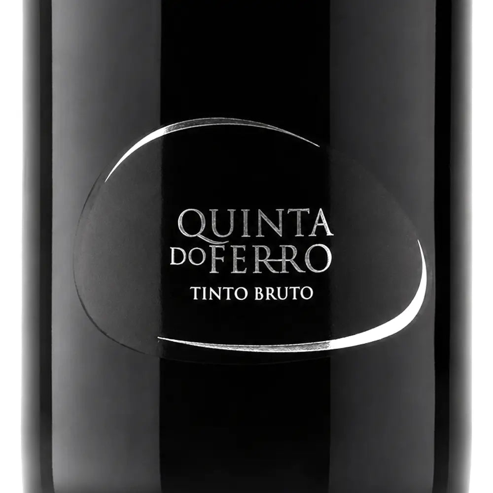 Close-up of a dark wine bottle label reading 'QUINTA DO FERRO' and 'TINTO BRUTO' in white text on a glossy black bottle.