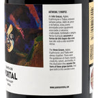 Portal-white. Close-up of a white wine bottle label with Portuguese and English text and an abstract dark artwork featuring a face, plus a partial side view of the bottle showing a gold band and barcode.