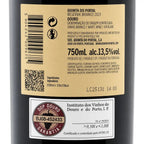 Close-up of a wine bottle label in Portuguese for Douro Reserva Branco 2023 by Quinta do Portal, showing the back label with barcode, QR code, product details, and a certification sticker.