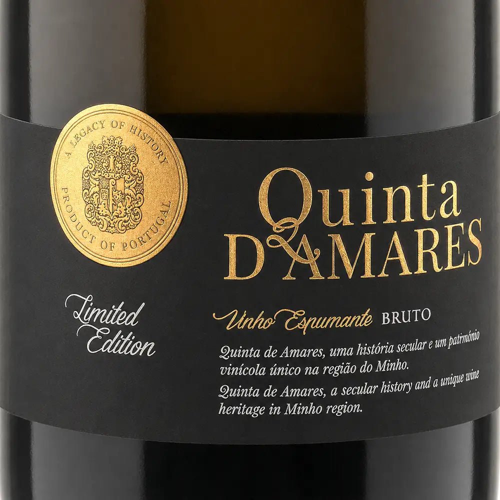Close-up of a Quinta de Amares wine bottle label, showing a black label with gold and white text, a gold crest seal, and 'Limited Edition' on a dark bottle background.