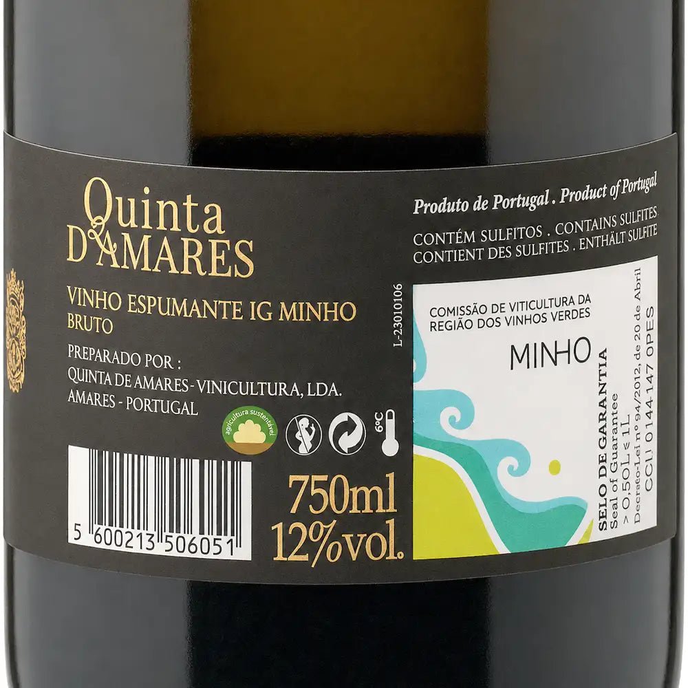 Close-up of a wine bottle label for Quinta D'Amares Bruto, showing the brand name in gold on a dark label with Portuguese text and a white section for Minho.