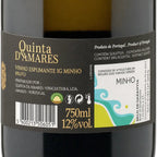 Close-up of a wine bottle label for Quinta D'Amares Bruto, showing the brand name in gold on a dark label with Portuguese text and a white section for Minho.