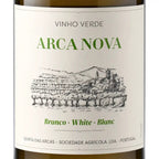 Front view of a wine bottle with a white label reading 'VINHO VERDE ARCA NOVA' and 'Branco • White • Blanc', plus a black line drawing of a vineyard and landscape. The bottle edges are dark green/brown glass visible at the top and bottom.