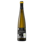 A tall glass bottle of white wine shown from the back, featuring a black neck sleeve, a gold foil top, and a black label with white text and a small green organic logo, set against a plain white background.