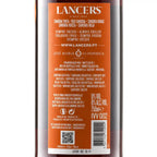 The back of a Lancers brand bottle, showing orange and white labeling with product details, ingredients, barcode, and QR code.