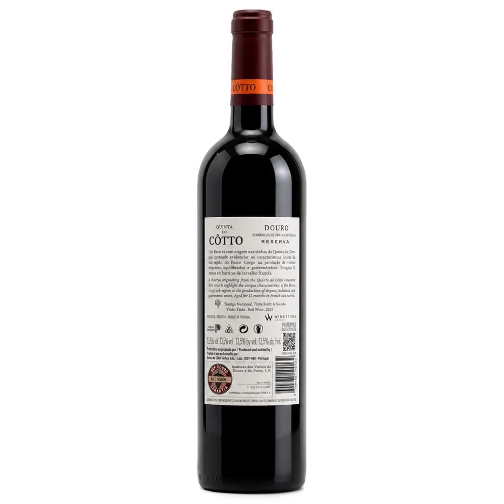 A bottle of Cotto Reserva red wine shown from the back, featuring a dark glass body, a dark red foil capsule, and a white label with black text and a barcode, set against a plain white background.