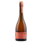A bottle of Deláncia sparkling wine with a dark amber glass body, a coral-pink label, and a matching foil seal on a white background.