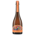 A bottle of Delância Orange with a vibrant, multicolored floral label and an orange neck foil, shown on a solid white background.