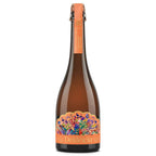 A bottle of Delância Orange with a vibrant, multicolored floral label and an orange neck foil, shown on a solid white background.