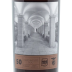 Wine bottle label with an architectural design and text on a white background