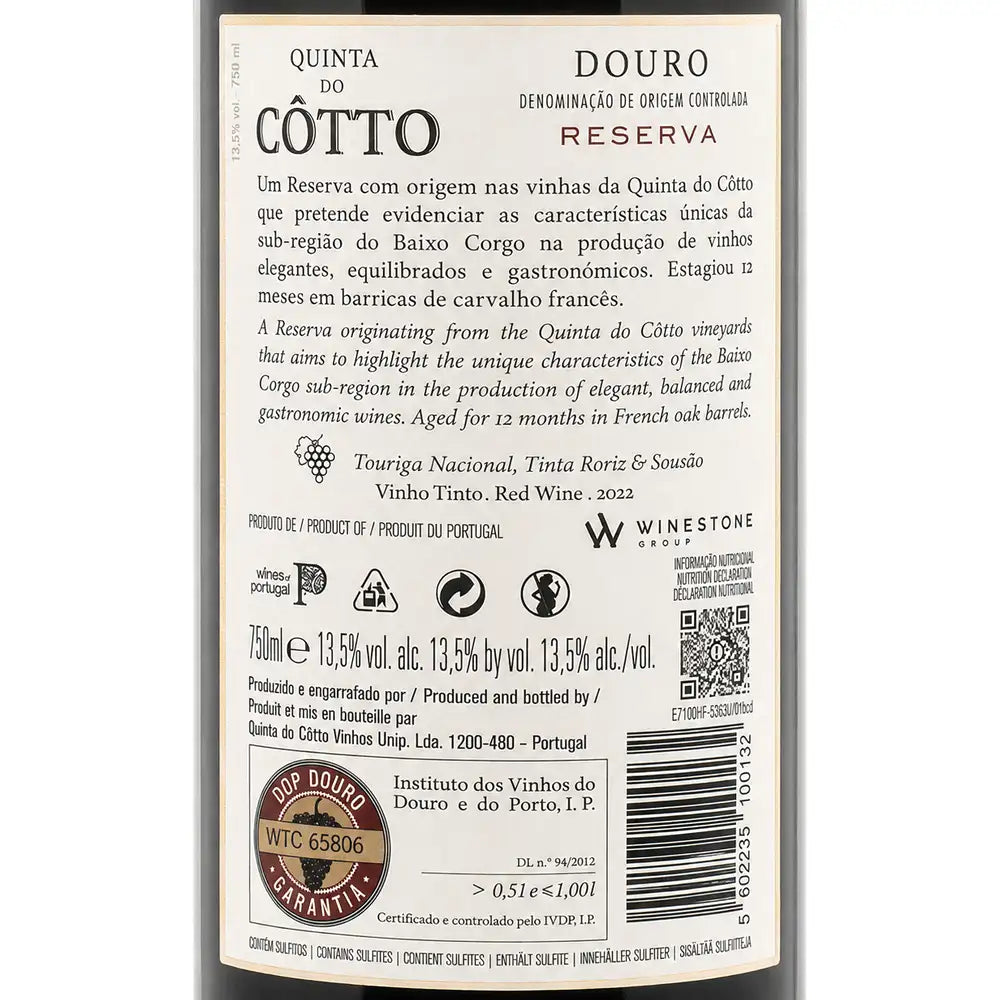 The back of a Quinta do Cótto Douro Reserva red wine bottle, showing the label text, wine details, and a WINESTONE guarantee seal on a dark bottle background.