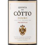 Front-facing wine bottle label for Quinta do Cotto Douro Reserva red wine, with a cream label, black and gold typography, and a decorative crest on a white background.