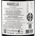 A close-up of a wine label reading MANOELLA DOURO, showing product details, wine type, producer information, barcode, and regulatory text on a white label.
