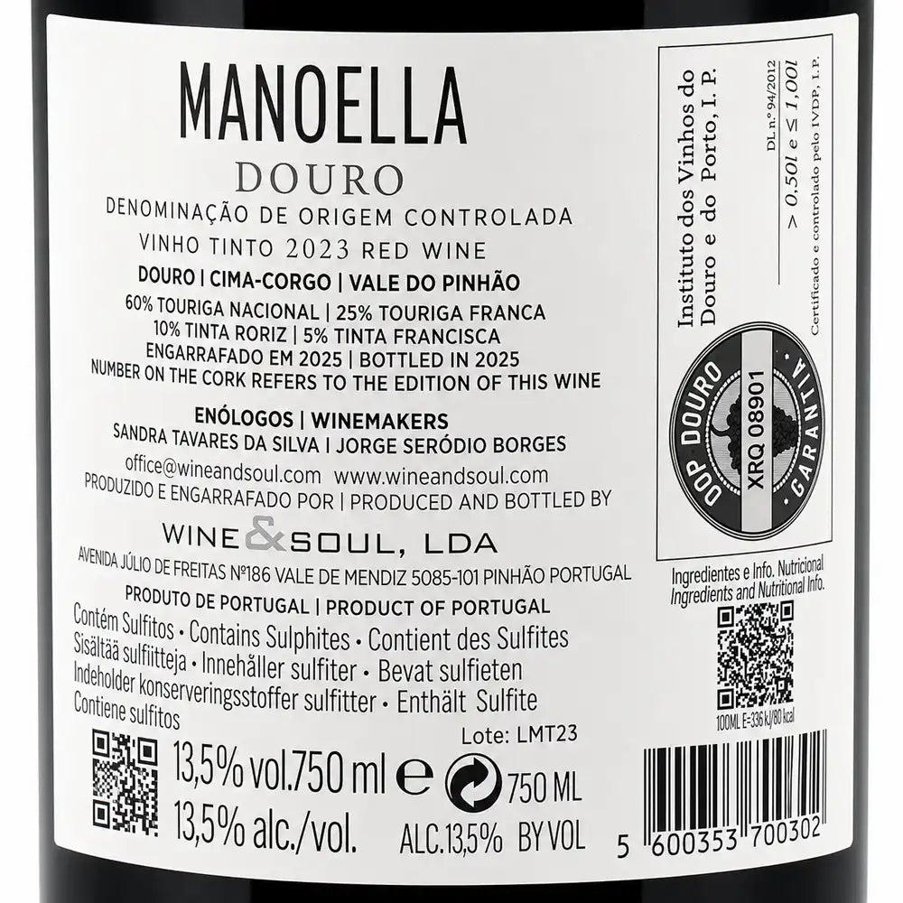 A close-up of a wine label reading MANOELLA DOURO, showing product details, wine type, producer information, barcode, and regulatory text on a white label.