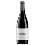 A bottle of Manoella Douro red wine with a white label and gray foil, photographed against a solid white background.