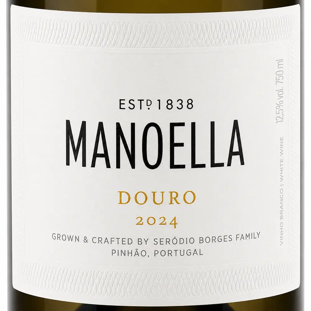 Close-up of a white wine label reading MANOELLA DOURO 2024, with black and gold typography on a clean white background.